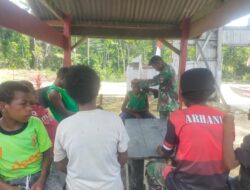 Satgas Yonif 126/KC Pangkas Rambut Anak-Anak di Perbatasan Papua