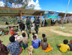 Satgas Yonif Mekanis 203/AK Gelar Kegiatan Sosial di Pasar Popome