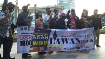 FWJ Realisasi 1000 Masker di Bundaran HI Tepati Pergub 41 Tahun 2020