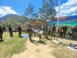 Satgas Yonif 203/AK Bersama Warga Adakan Karya Bhakti di Pasar Popome