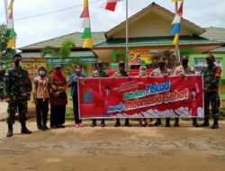 Perayaan HKN ke-56, Satgas Yonif 642 Bagi Masker dan Sosialisasi Protokol Kesehatan Bersama Stakeholder