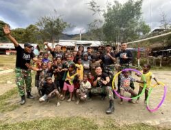 Satgas Yonif Mekanis 203/AK Bahagiakan Anak-Anak di Distrik Malagayneri